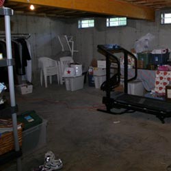 An unfinished basement filled with clutter in Norwalk.