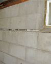 Severely buckling foundation walls in a home in Manorville in need of repairs.