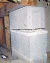 Concrete crawl space support posts in Wethersfield that are showing signs of failure as they sink into the earth.