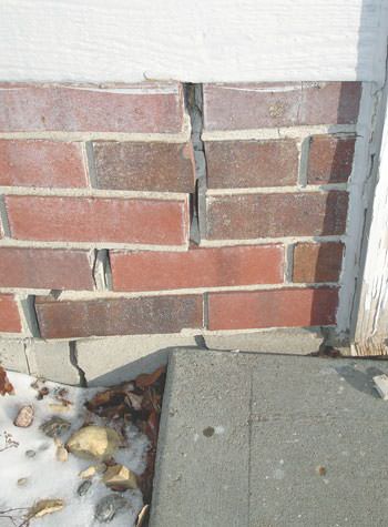 Severe street creep damage to a garage wall outside a Litchfield home