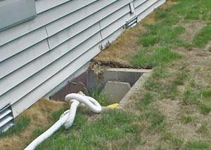 Fiberglass dripping off of the ceilings of a Hartford crawl space