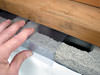 Clear plastic vapor barrier covering for block walls in Greenwich