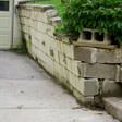 a collapsing retaining wall in Milford