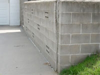 A retaining wall separating from the adjoining walls in East Lyme