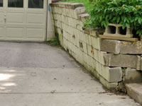 a failing retaining wall around a driveway in Stamford