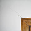 wall cracks along a doorway in a Simsbury home.