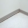 A partition wall separating from the floor in a Meriden home.
