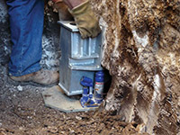 Securing a foundation footing bracket for a foundation repair system in Wilton.