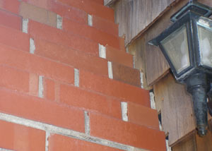 a repaired chimney in Southington that had shown serious foundation damage and was repaired with a helical pier system.