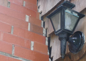 A tilting chimney in Southington showing serious foundation damage.