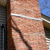A tilting chimney on a Brookfield home with a leaning, tilting chimney that was temporarily repaired.