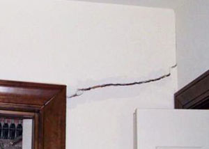 A large drywall crack in an interior wall in Hamden