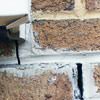 Failed crack repair showing old tuckpointing that cracked on a West Hartford home.