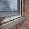 A gap in a window along the outer wall due to foundation settlement of a Simsbury home.