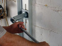 Mounting a foundation wall channel anchor in Poughkeepsie.