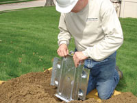 Fastening an earth anchor for a severely bowing wall in Milford.