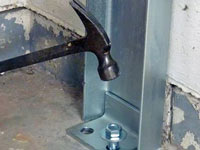 Mounting a foundation channel anchor installation to the floor in Poughkeepsie.