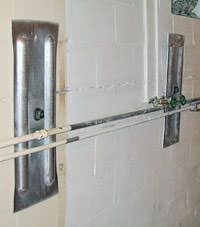 A foundation wall anchor system used to repair a basement wall in Watertown