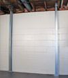 A steel i-beam system installed on a East Lyme foundation wall