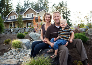 A happy family outside a home with a repaired foundation in North Haven