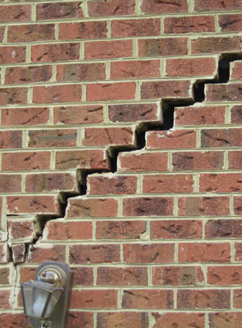 major cracking of a brick foundation wall in Avon