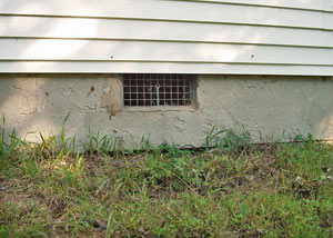 Open crawl space vents that let rodents, termites, and other pests in a home in Wilton