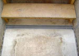 Our grated drain system installed on a leaking basement staircase in Avon.