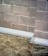 Our baseboard drain system installed on a corner in a Trumbull basement.