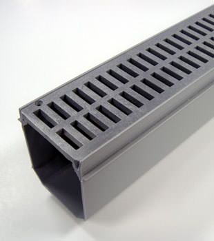 A closeup of our grated basement drainage pipe system, installed in Danbury