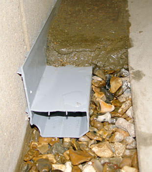 A basement drain system installed in a Milford home