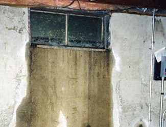 Water pouring out from a basement window in Fairfield
